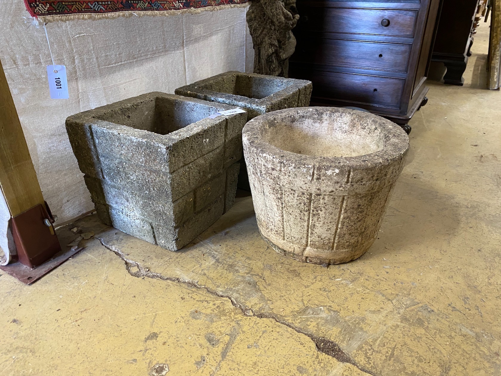 A pair of reconstituted stone 'brick' square garden planters, width 33cm, height 30cm together with a similar circular garden planter